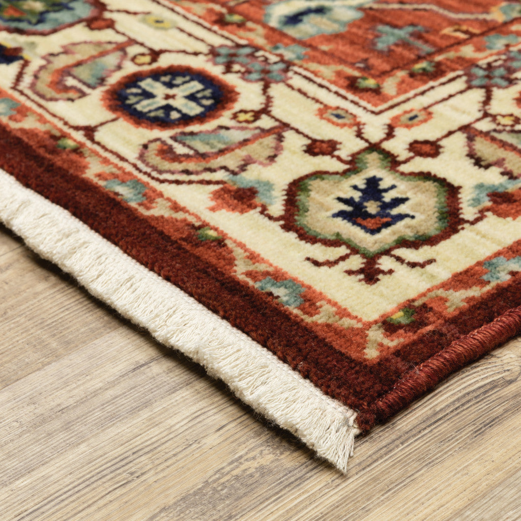 5' X 8' Red Ivory Orange And Blue Oriental Power Loom Stain Resistant Area Rug With Fringe