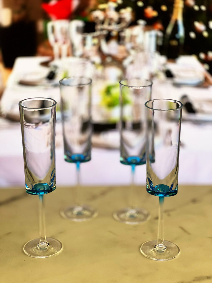 Set of Four Clear and Blue Acrylic Stemmed Flutes