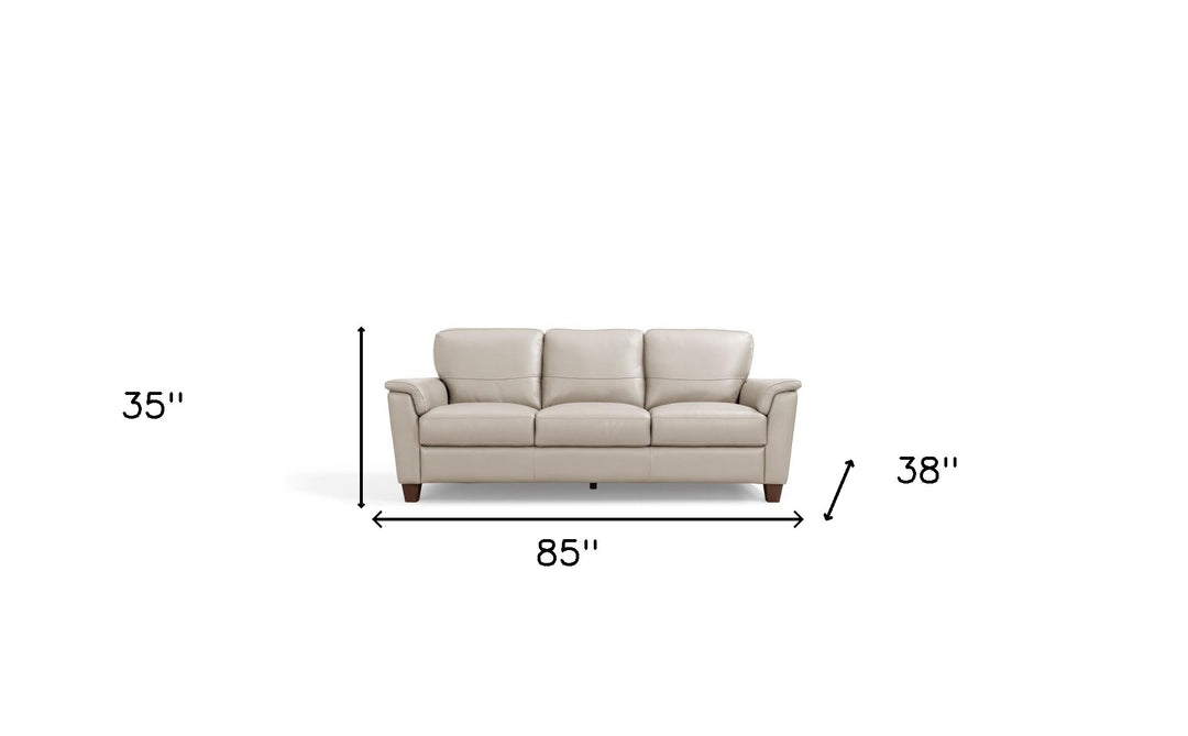 85" Beige Leather And Black Sofa