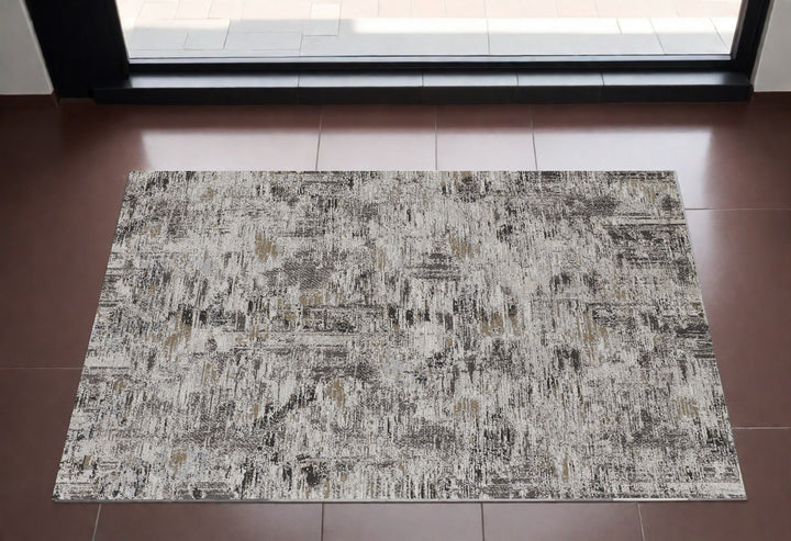 2' x 3' Brown and Ivory Abstract Power Loom Distressed Area Rug
