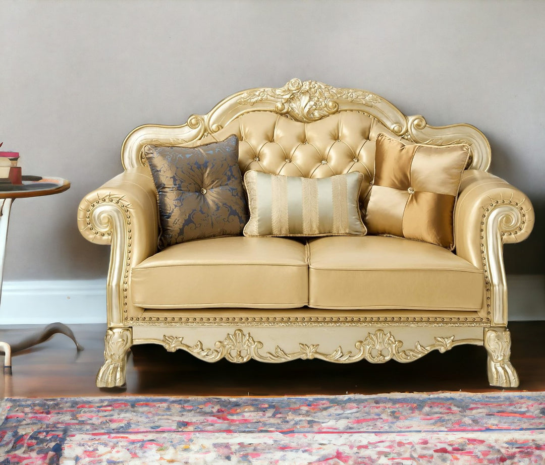 64" Bone And Gold Faux Leather Loveseat and Toss Pillows