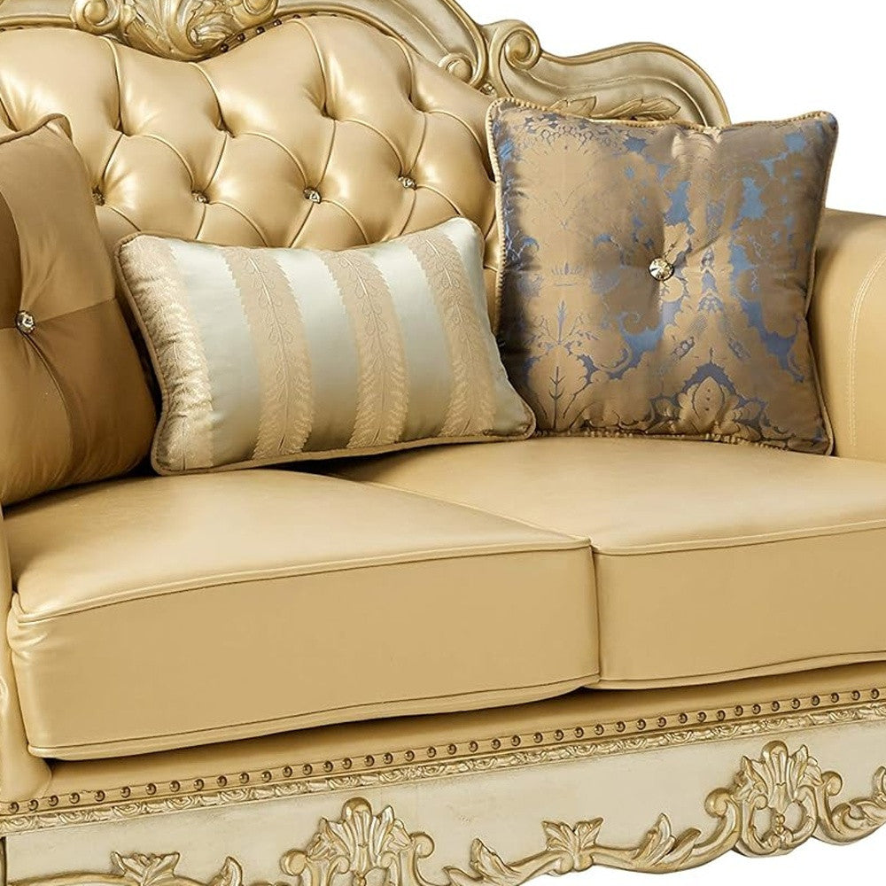 64" Bone And Gold Faux Leather Loveseat and Toss Pillows