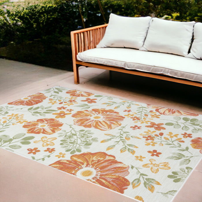 8' x 10' Ivory Green and Orange Floral Stain Resistant Indoor Outdoor Area Rug