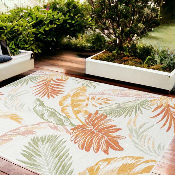 8' x 10' Ivory Green and Orange Palm Leaf Stain Resistant Indoor Outdoor Area Rug