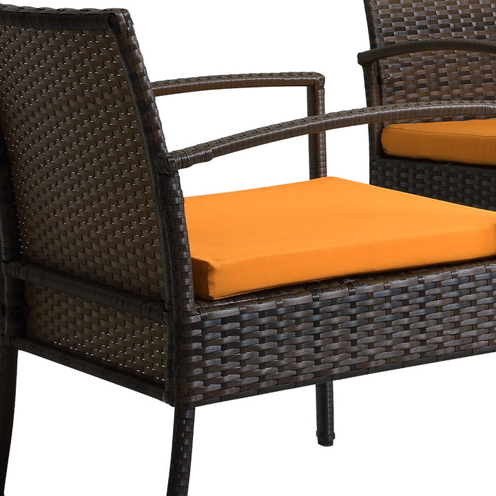 Four Piece Outdoor Brown Wicker Sofa Seating Group with Orange Cushions