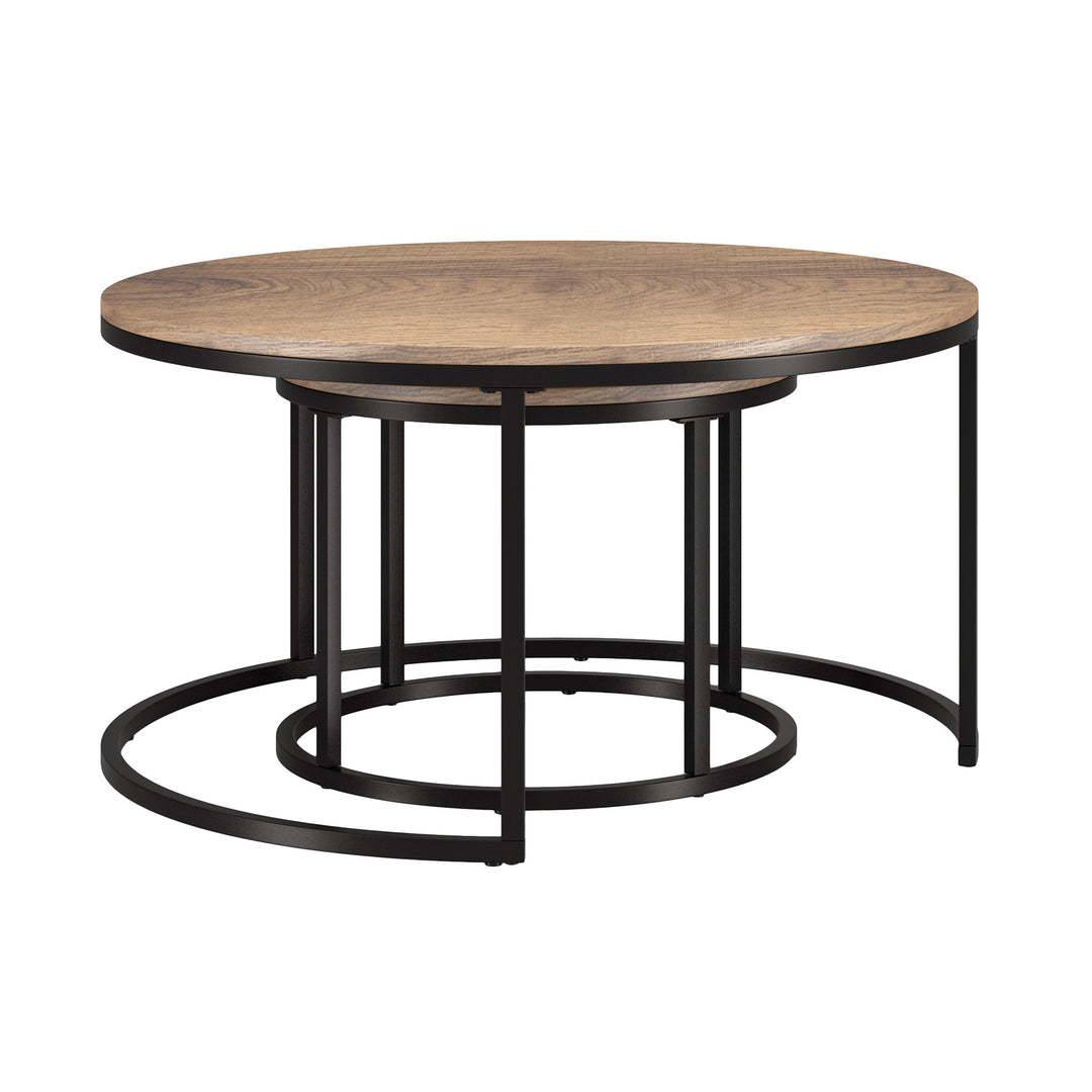 Set Of Two 35" Black And Brown Round Nested Coffee Tables